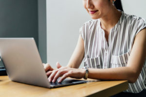 adult woman working on a laptop